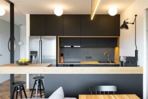 Black Wooden Furniture And An Industrial Lamp Above A Coffee Mac 300x200